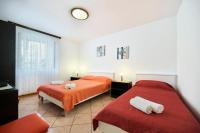 Postel nebo postele na pokoji v ubytování Apartman Ema