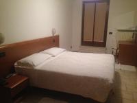 Posteľ alebo postele v izbe v ubytovaní Hotel Scandola