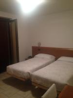 Posteľ alebo postele v izbe v ubytovaní Hotel Scandola