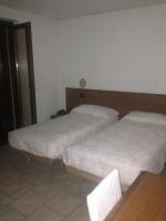 Posteľ alebo postele v izbe v ubytovaní Hotel Scandola