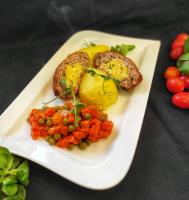 a plate of food with vegetables on a table at Hotel Lilia in Włoszczowa