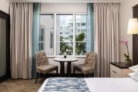 Ein Bett oder Betten in einem Zimmer der Unterkunft The Palms Hotel &amp; Spa