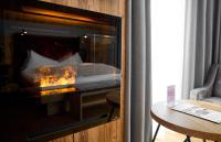 Łóżko lub łóżka w pokoju w obiekcie Hotel Gamsleiten