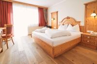 Łóżko lub łóżka w pokoju w obiekcie Hotel Gamsleiten