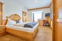 Łóżko lub łóżka w pokoju w obiekcie Hotel Gamsleiten