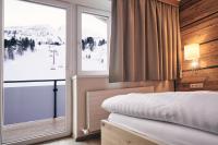 Łóżko lub łóżka w pokoju w obiekcie Hotel Gamsleiten