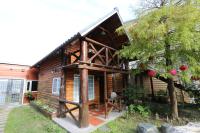 a wooden house with a large gambrel roof at Dongshan River Resort Farm in Wujie