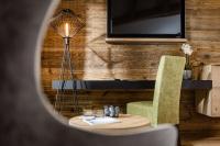 Televízia a/alebo spoločenská miestnosť v ubytovaní Hotel Erika