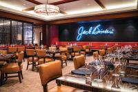 a restaurant with tables and chairs and a sign on the wall at Horseshoe Las Vegas in Las Vegas