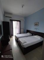 Posteľ alebo postele v izbe v ubytovaní Dimitropoulos Apartments