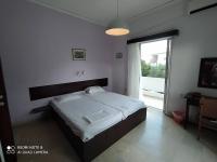 Posteľ alebo postele v izbe v ubytovaní Dimitropoulos Apartments