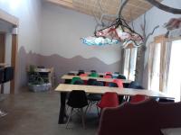 a conference room with a table and chairs at Mas la Llum, la casa de palla in Arens de Lledó