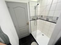 a bathroom with a shower and a glass door at Les Coulisses de l&#39;HORLOGE - WIFI - 50 m Palais des Papes in Avignon