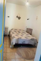 Posteľ alebo postele v izbe v ubytovaní Appartement au calme au milieu du vignoble de Gigondas