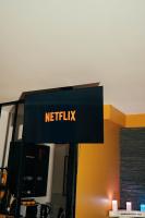 a netflix sign on top of a desk at HomeSparadise Loveroom in Besançon