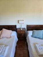Postel nebo postele na pokoji v ubytování Casa das Acácias