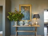 a painting of a man on a table with a lamp at The Principal Madrid, Small Luxury Hotels in Madrid