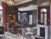 a bar with chairs and a fireplace in a room at The Principal Madrid, Small Luxury Hotels in Madrid
