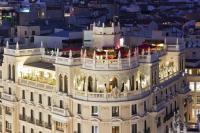 a view of a building at night at The Principal Madrid, Small Luxury Hotels in Madrid