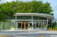 an office building with a green building at Fisherman Way Beach Villa in Rawai Beach