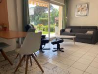 a living room with a couch and a table and chairs at Appartement Capbreton, 2 pièces, 4 personnes - FR-1-239-872 in Capbreton