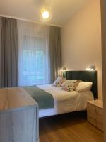 Posteľ alebo postele v izbe v ubytovaní Apartament Zen