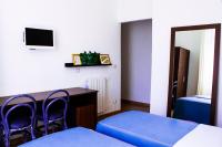 Televízia a/alebo spoločenská miestnosť v ubytovaní Hotel Anacapri