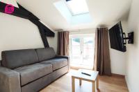 a living room with a couch and a window at Le Cypri&#39;Deux by iZiLi *Confort*Calme* in Poitiers