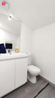 a white bathroom with a toilet and a sink at Le Cypri&#39;Deux by iZiLi *Confort*Calme* in Poitiers