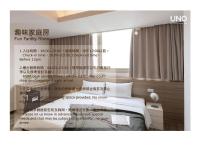 a poster of a hotel room with a bed at Uno Backpackers Inn in Kaohsiung