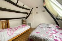 Łóżko lub łóżka w pokoju w obiekcie Gîte Etienne Marie
