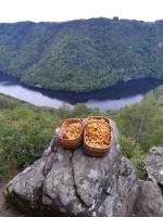 two baskets of food sitting on top of a rock at Gîte du Busatier in Marcillac-la-Croisille