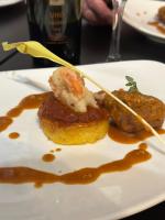 een bord met vlees en saus erop bij Inn at the Art Center in San Angelo