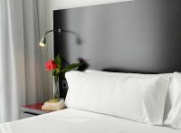 Postel nebo postele na pokoji v ubytování SM Hotel Sant Antoni