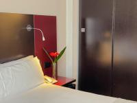 Postel nebo postele na pokoji v ubytování SM Hotel Sant Antoni