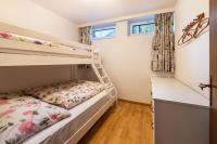 Uma ou mais camas em beliche em um quarto em Ferienwohnung im Haus St&ouml;ckl