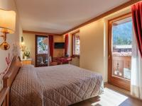 Hotel Garnì La Montanaraにあるベッド