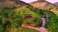 an aerial view of a house on a hill at Eco Lodge de Construção Natural com Vista Panorâmica in Nova Friburgo