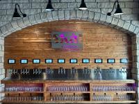 a brick wall with a bunch of wine glasses at Bluemont Hotel in Manhattan