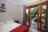 Cama ou camas em um quarto em Pousada e Restaurante Paraíso Natural