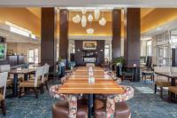 a large dining room with a long table and chairs at Hilton Garden Inn Fargo in Fargo