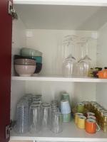 a shelf filled with glass jars and other items at Chez Mélanie in Marseille