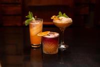 three cocktails sitting on top of a table at Hilton Ponce Golf & Casino Resort in Ponce