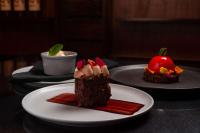two pieces of chocolate desserts on plates on a table at Hilton Ponce Golf & Casino Resort in Ponce