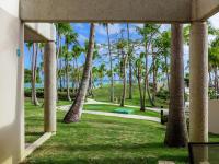 a view of a park with palm trees at Hilton Ponce Golf & Casino Resort in Ponce