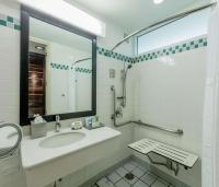 a bathroom with a sink and a mirror at Hilton Ponce Golf & Casino Resort in Ponce
