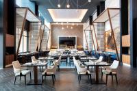 a large dining room with tables and chairs at Hilton Monterrey Valle in Monterrey