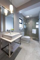 a bathroom with a sink and a toilet and a shower at Deerpark Luxury Stays in Nairobi