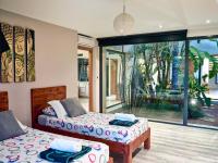 A bed or beds in a room at Can Do It