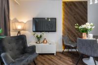 Televízia a/alebo spoločenská miestnosť v ubytovaní Apartment 24 Premium Old Town Wroclaw
